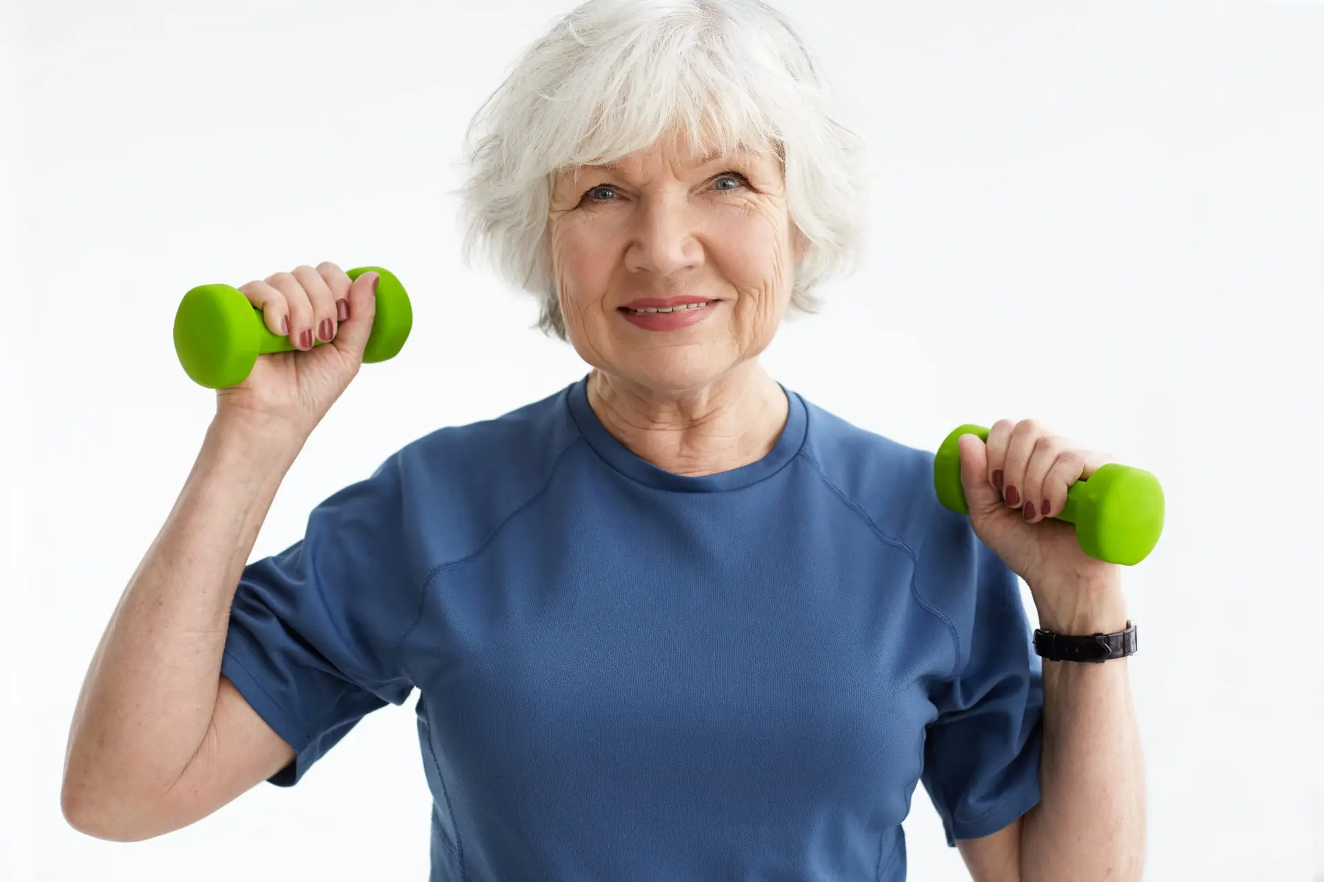 Mature woman strength training with weights during menopause physiotherapy in Harrogate